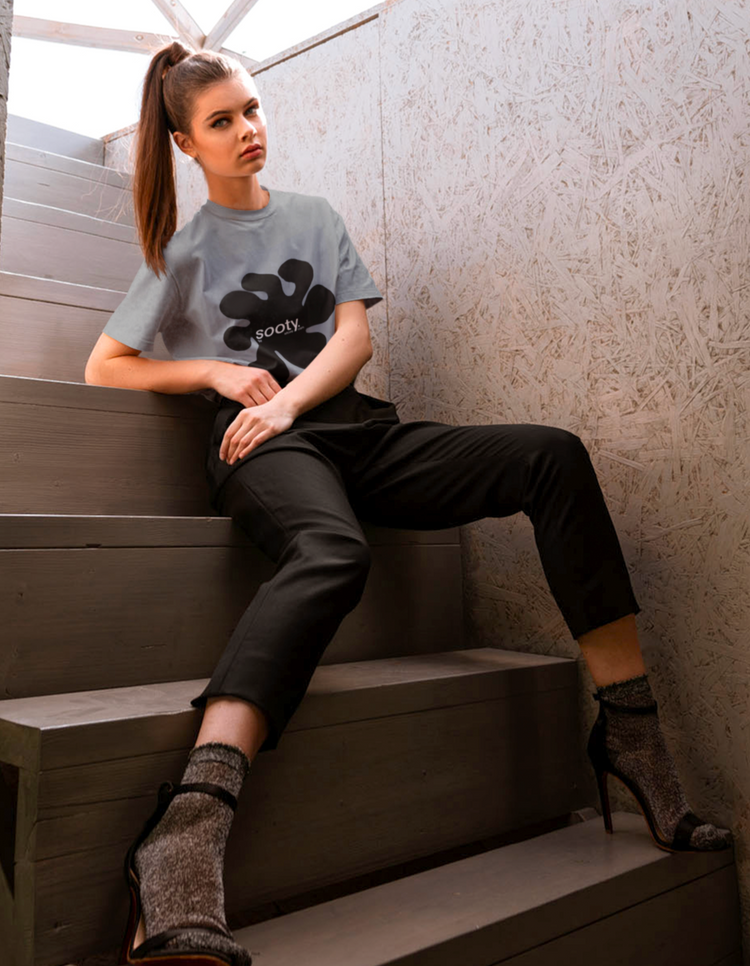 Sultry woman wearing grey sooty logo t-shirt