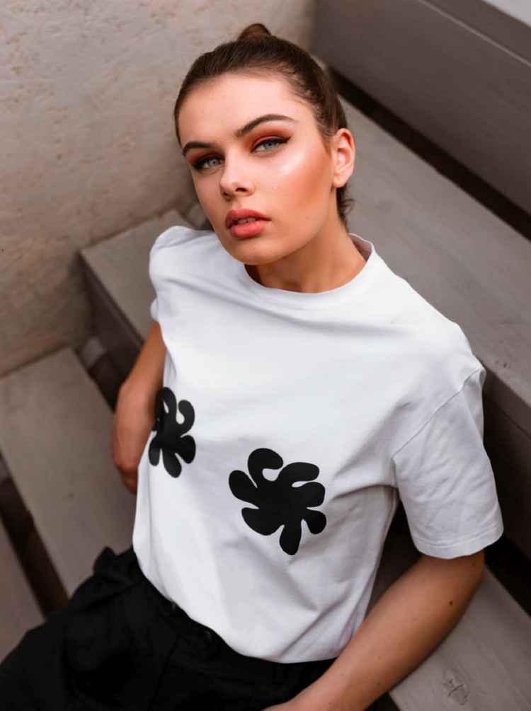 The sooty store white t shirt with black nipple logo shapes